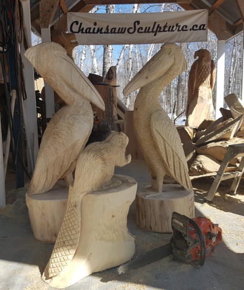 Chainsaw carved pelican and beaver