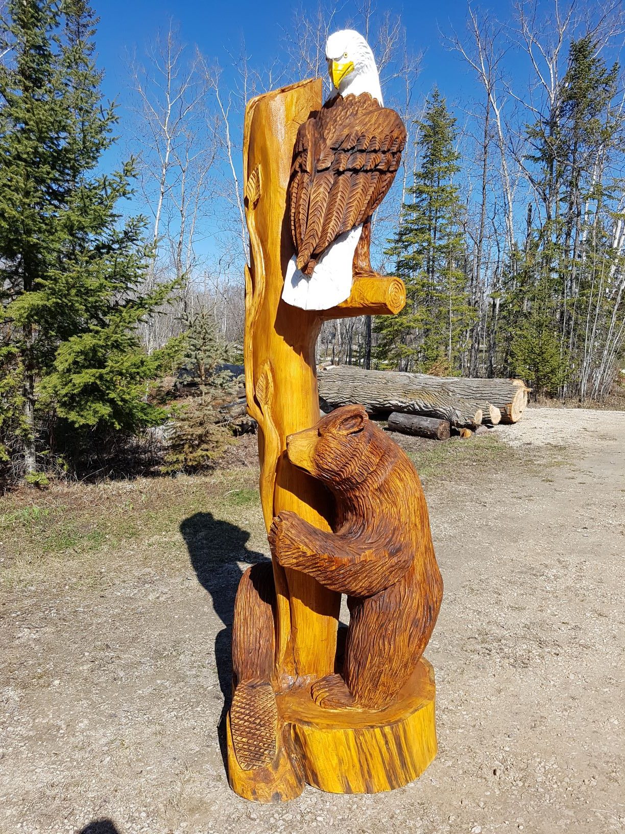 Chainsaw carved bear, eagle and beaver