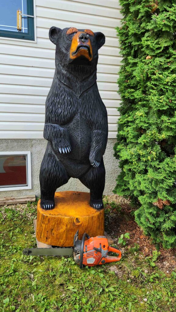 chainsaw carved large black bear